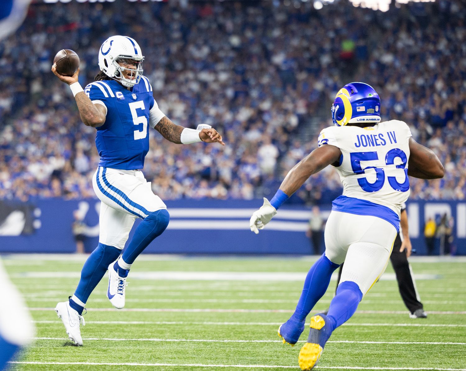 Oct 1, 2023; Indianapolis, Indiana, USA; Indianapolis Colts quarterback Anthony Richardson (5) passes the ball while Los Angeles Rams linebacker Ernest Jones (53) defends in the second half at Lucas Oil Stadium. Mandatory Credit: Trevor Ruszkowski-USA TODAY Sports